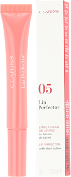 Różowy Clarins Lip Perfector z masłem shea w tubce, obok białe opakowanie z numerem 05, widok z przodu.