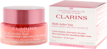 Clarins Multi-Active Nuit przeciwzmarszczkowy krem na noc z niacynamidem w różowym słoiczku i pudełku.