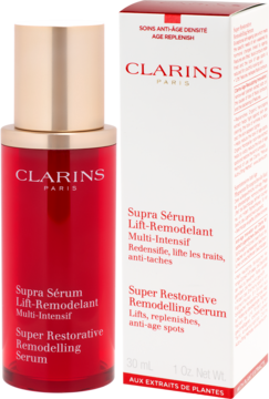 Clarins Super Restorative serum: czerwona butelka ze złotym korkiem i biało-czerwone pudełko obok, widok z przodu.
