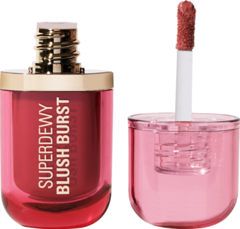 Otwarty róż w płynie Revolution Superdewy Blush Burst Rose All Day. Różowa butelka, złota szyjka i aplikator z kolorem.
