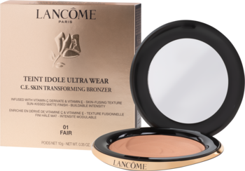Otwarty bronzer Lancôme Teint Idole Ultra Wear 01 Fair, matowy puder z lusterkiem, obok złote pudełko.