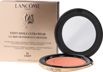 Bronzer Lancôme Teint Idole Ultra Wear Light, otwarty kompakt z lusterkiem i brzoskwiniowym pudrem, na tle złotego pudełka.