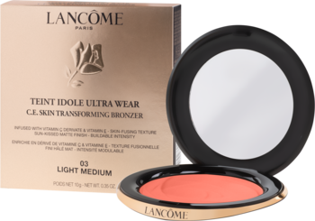 Lancôme Teint Idole Ultra Wear bronzer 03 Light Medium: otwarty złoty kompakt z brzoskwiniowym pudrem, obok złote pudełko.