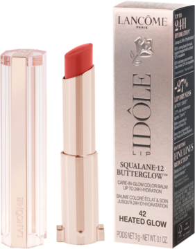 Lancôme Idôle Squalane-12 Butterglow, koralowa pomadka w rose gold etui, otwarta, obok jej czarne pudełko.