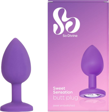 Fioletowy silikonowy korek analny So Divine Sweet Sensation z klejnotem, obok fioletowego opakowania produktu.