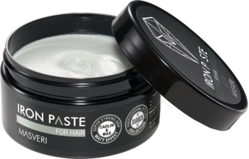 Otwarta czarna pasta IRON PASTE do włosów, biała, matowa, mocno utrwalająca, wieczko obok słoika.