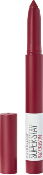 Czerwona pomadka Maybelline Super Stay Ink Crayon z odkrytą końcówką w kształcie kredki, obok leży skuwka.