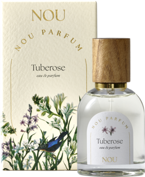 Damska woda perfumowana Nou Tuberose. Przezroczysta butelka z drewnianą nakrętką stoi przed beżowym pudełkiem z kwiatowym wzorem.