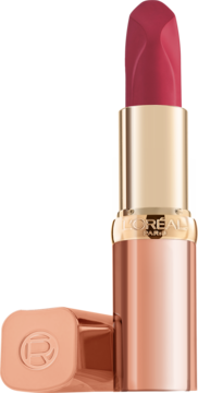 Otwarta szminka L'Oréal Color Riche Les Nus w odcieniu intensywnej fuksji, złote etui, obok leży skuwka.