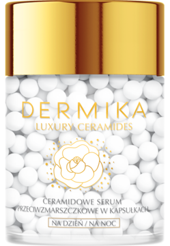 Dermika Luxury Ceramides serum przeciwzmarszczkowe w kapsułkach, słoik z białymi kuleczkami i złotą nakrętką, widok frontalny.