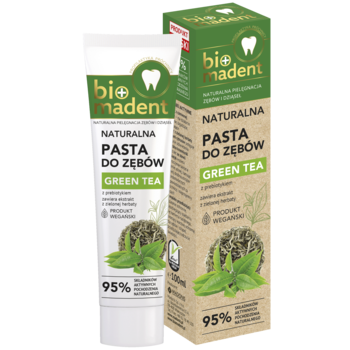 Naturalna pasta do zębów Bio Madent Green Tea w zielono-białej tubce i pudełku z liśćmi herbaty, widok z przodu.