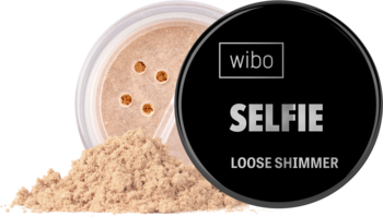 Otwarty słoiczek rozświetlacza Wibo Selfie Loose Shimmer Sunny Gold z rozsypanym złocistym pudrem.