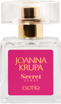 Perfumy Joanna Krupa Secret Sense w przezroczystej butelce z różową etykietą i złotymi napisami, widok z przodu.