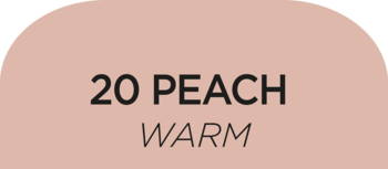 Brzoskwiniowy odcień korektora 20 Peach Warm na półokrągłej próbce, czarny tekst na beżowym tle.